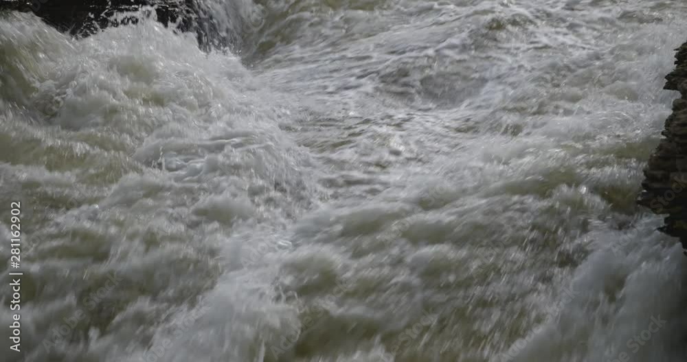 Fast-moving water passing through river Rapids close up view Fast-moving water passing through river Rapids close up view