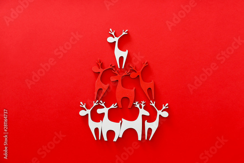 Decorative Christmas deer on color background