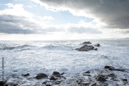 breaking waves on a stony beach
