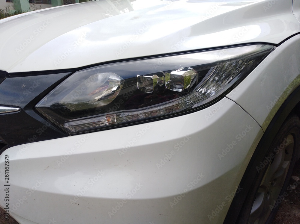 White car front headlight with shallow depth of field White car front headlight with shallow depth of field