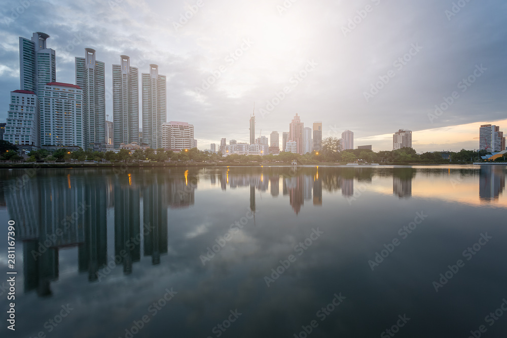 City building with water reflection before sunset