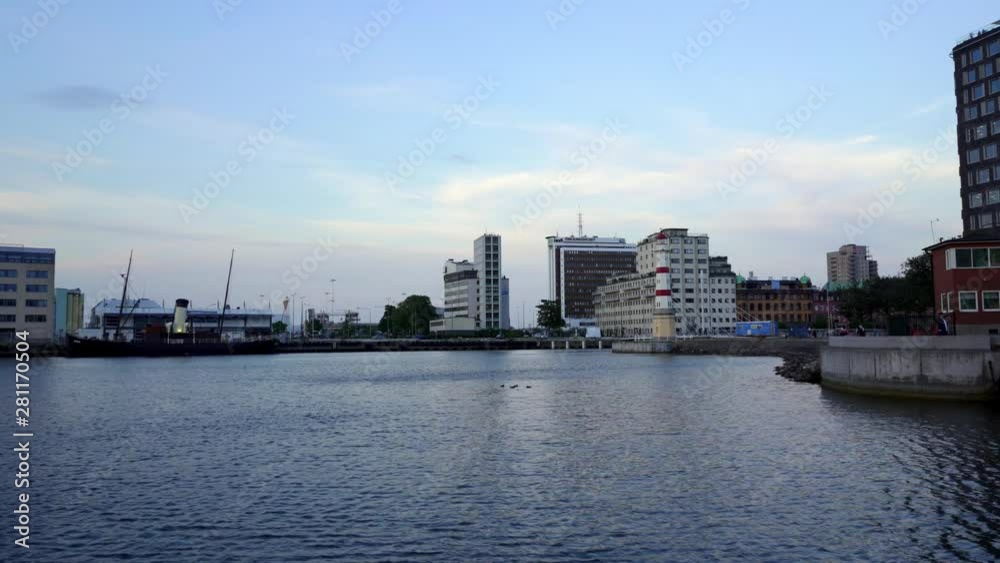 Malmo, the industrial docks in the old town with the light house and other buildings at dusk. Sweden Malmo, the industrial docks in the old town with the light house and other buildings at dusk. Sweden