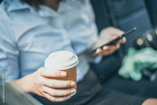 hand holding coffee cup to take away