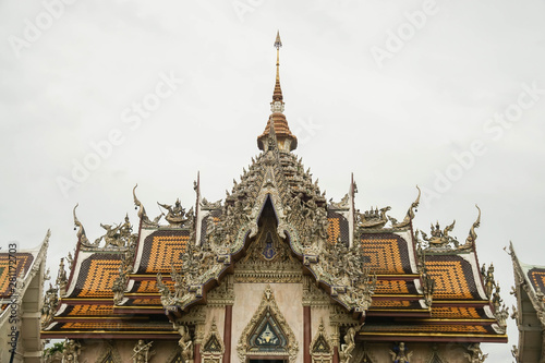 Nakhonpathom / Thailand - July 3 2019: Close up beautiful Srisathong temple roof for Buddhist respect and make merit