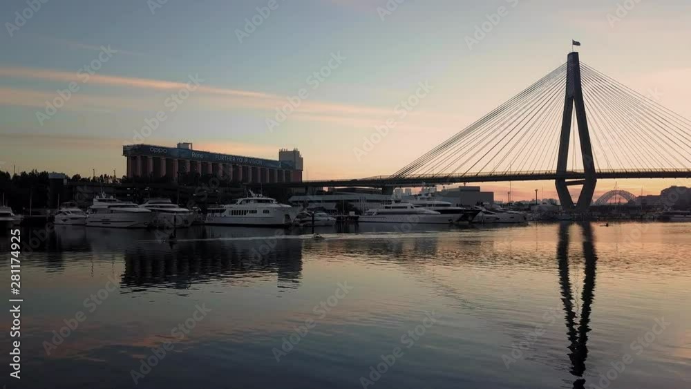 Aerial view of kayakers in front of the Anzac Bridge in Sydney at sunrise Aerial view of kayakers in front of the Anzac Bridge in Sydney at sunrise