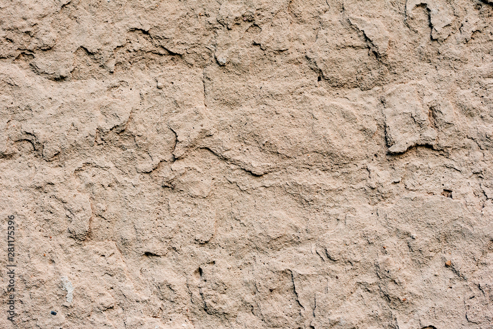 Texture of a concrete wall with cracks and scratches which can be used as a background