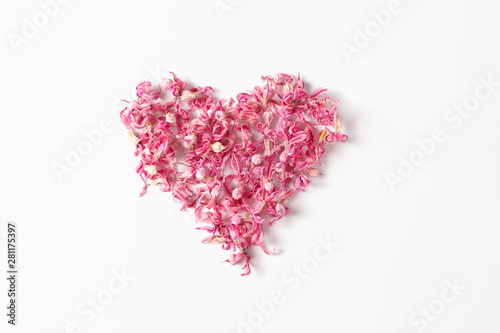 heart symbol made of flowers. pink hyacinth flowers on white background. flat lay, top view
