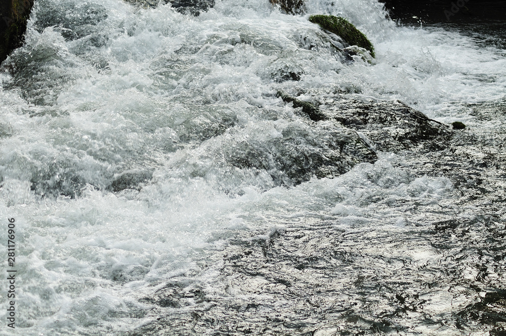 water splashing over rocks water splashing over rocks