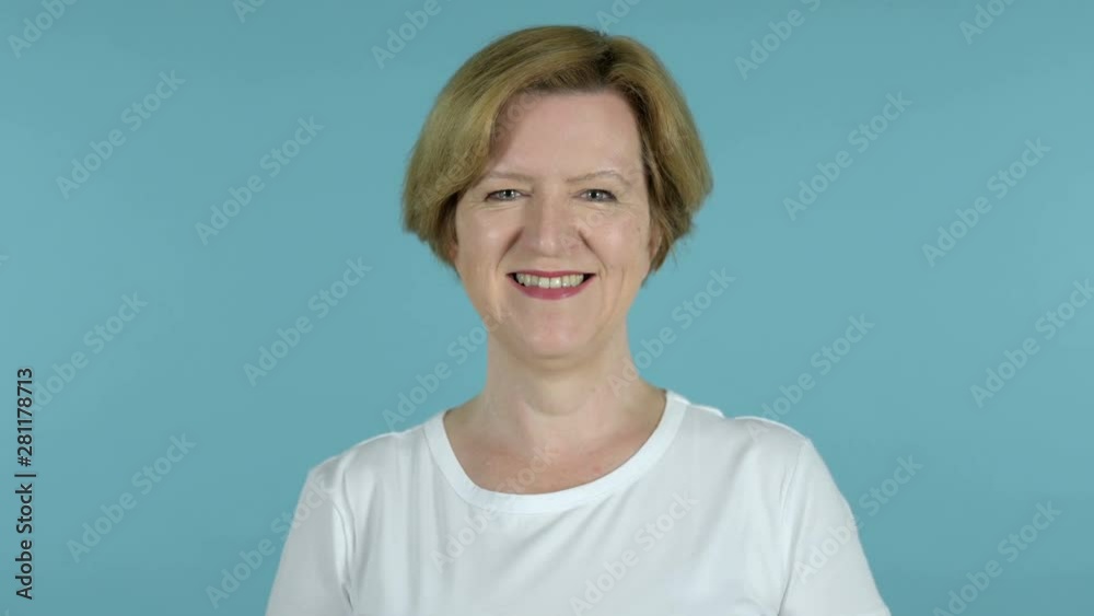 Smiling Old Woman Isolated on Blue Background Smiling Old Woman Isolated on Blue Background