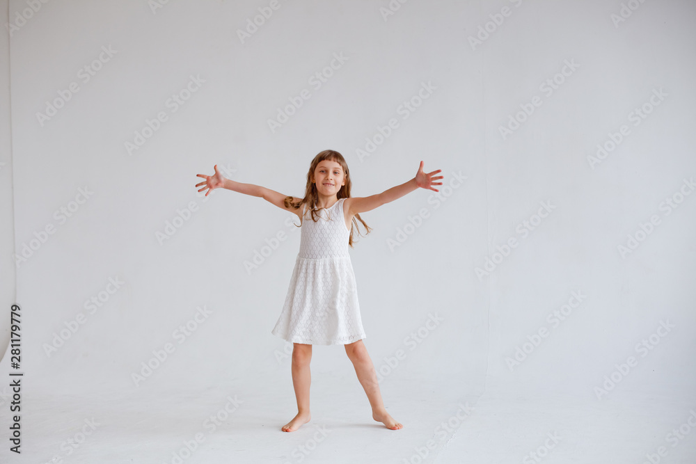 Obraz premium girl in white dress dancing on white background