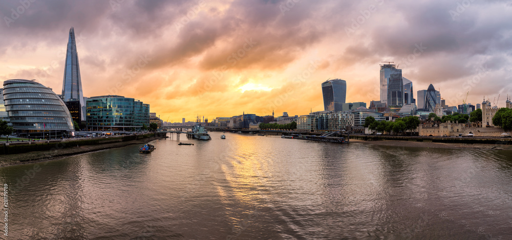Panorama of London skyline along the Thames river during sunset time, United Kingdom.