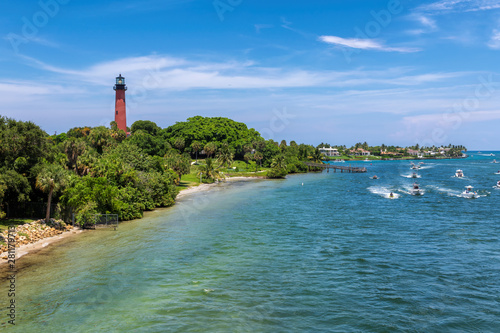 Beautiful view of the Jupiter lighthouse and boats on the sea in Palm Beach County, Florida.