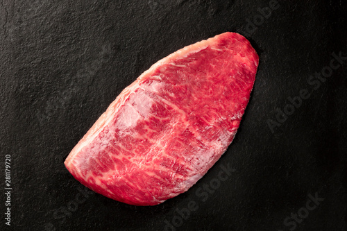 Kobe meat, wagyu beef steak, shot from the top on a black background with a place for text