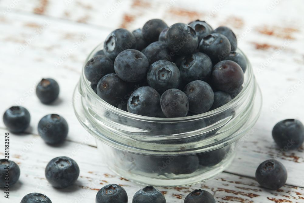 A glass bowl with blueberry