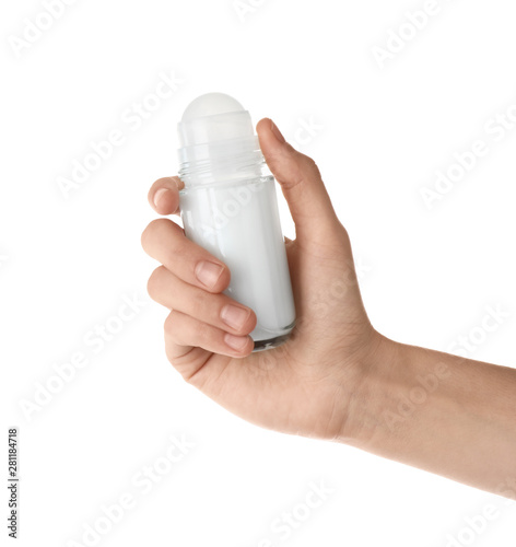 Woman holding roll-on deodorant on white background, closeup
