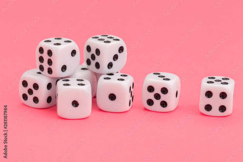 Gaming dice on pink background. Concept for games.