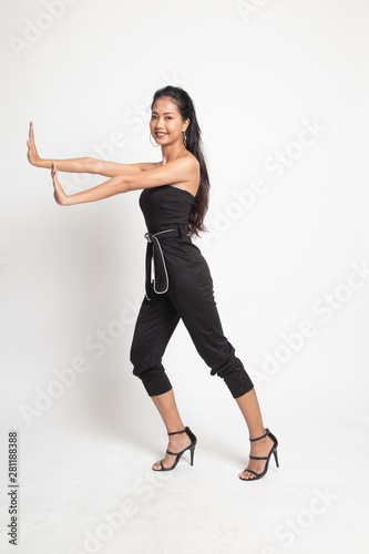 Full body of beautiful young asian woman push something.