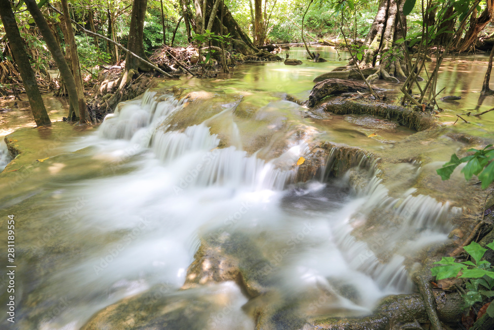 water fall in nature with green trees in Kanchanaburi, Thailand