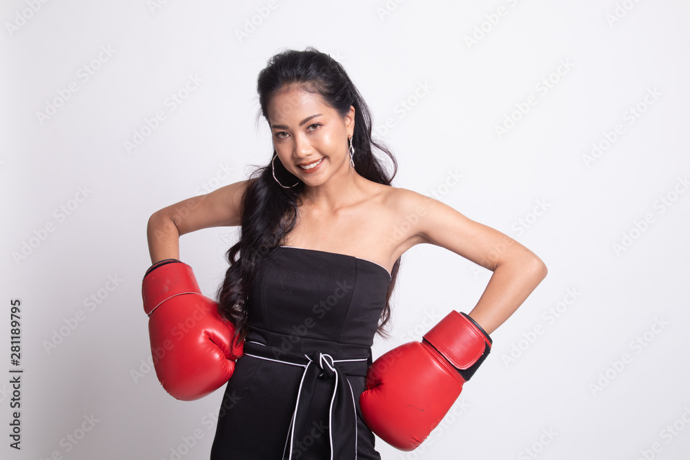 Young Asian woman with red boxing gloves. Young Asian woman with red boxing gloves.