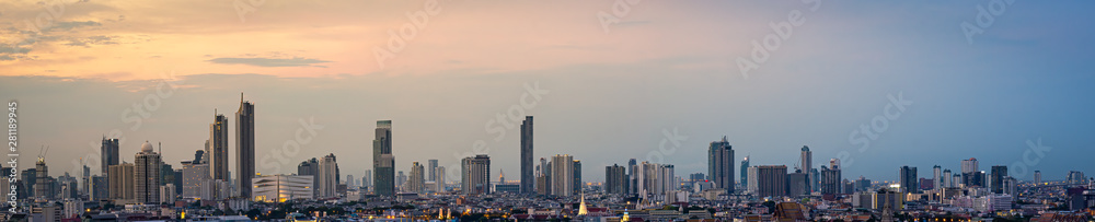 Panorama High rise office building The city centre of Bangkok. At dawn, the light from the sky is orange.