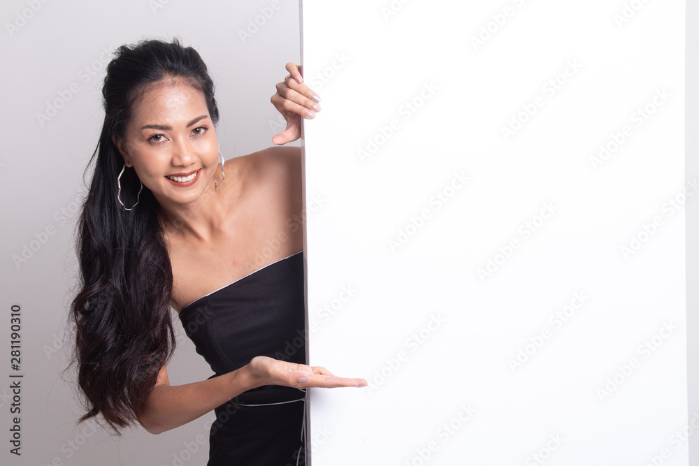Young Asian woman present blank sign with palm hand. Young Asian woman present blank sign with palm hand.