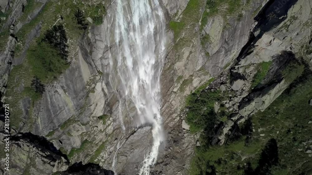 Aerial Flight over Beautiful waterfall in the Alps Aerial Flight over Beautiful waterfall in the Alps