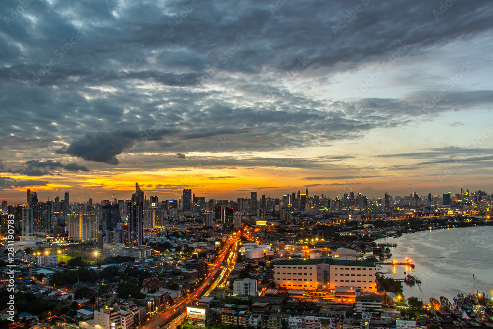 Fototapeta premium Sky view of Bangkok with skyscrapers in the business district in Bangkok along the Chao Phraya Rive in the during beautiful twilight give the city a modern style.