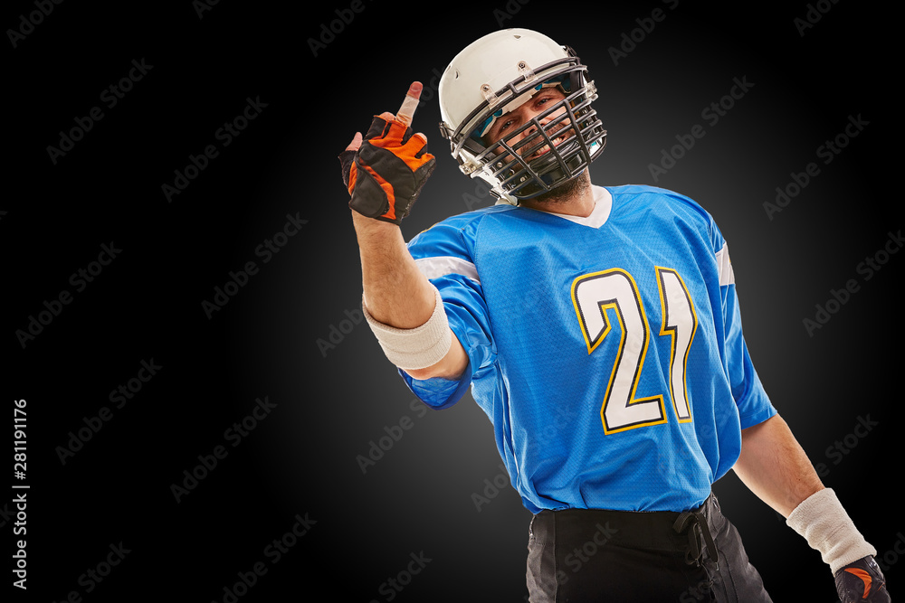 American football player in uniform shows hand fuck. American football,  copy space, black background. foto de Stock | Adobe Stock