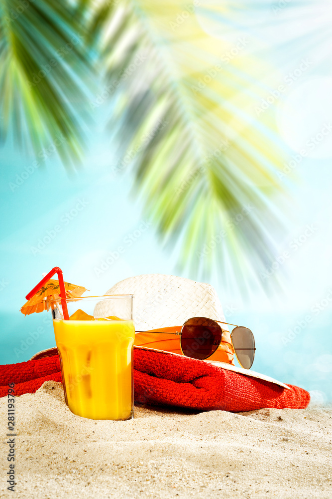 Table background with orange ice juice in a glass on a wooden table top with beautiful blue sky and ocean and palm tree view. Table background with orange ice juice in a glass on a wooden table top with beautiful blue sky and ocean and palm tree view.