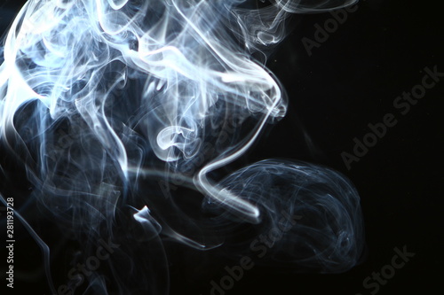 lovely swirl contrast blue smoke on the dark background. © Dancing Man
