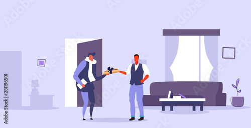 man receiving wrapped gift box from male courier express delivery concept modern living room interior flat horizontal full length