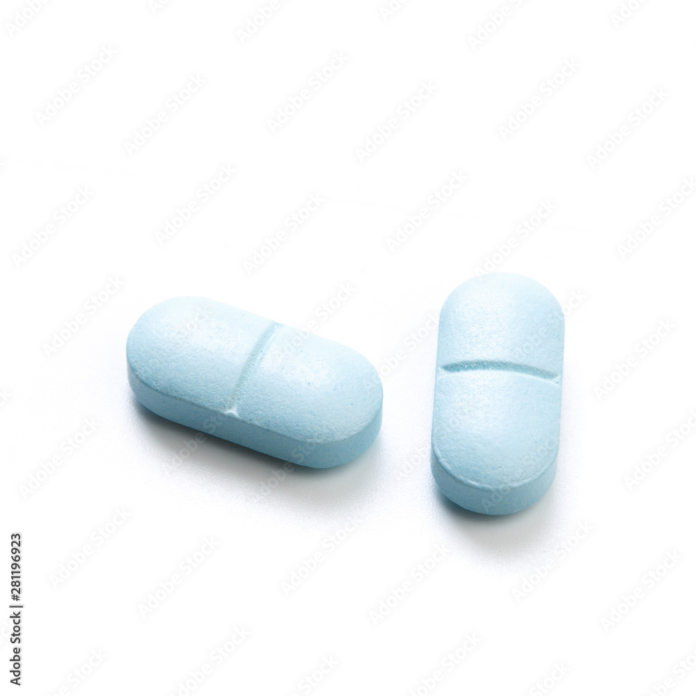 Blue tablets isolated on white background. Blue tablets isolated on white background.