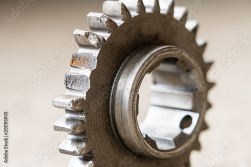 Closeup view on broken teeth on the gear. Mechanical workshop and repair concept.