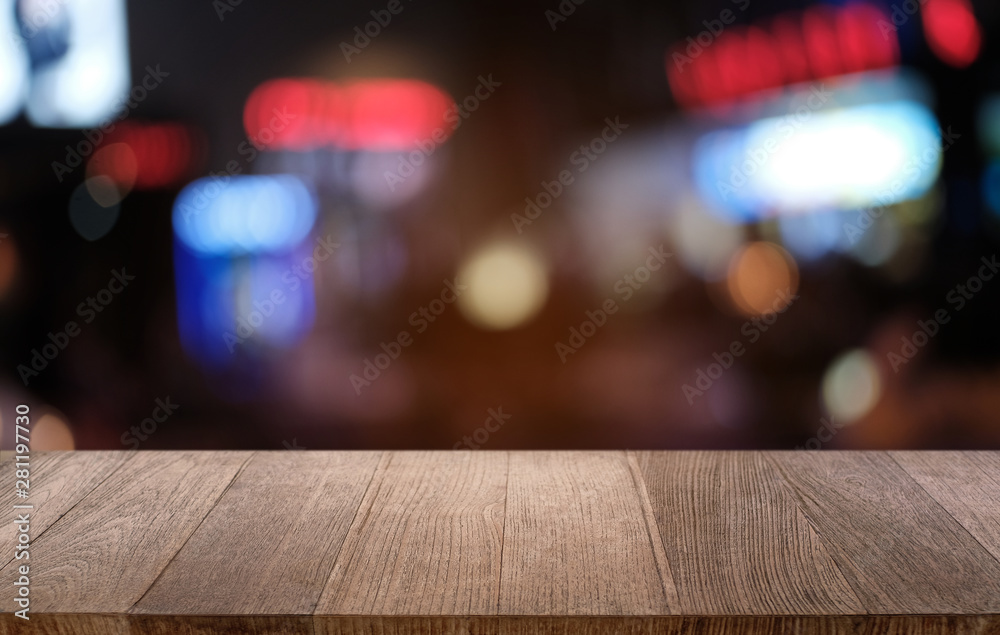 Empty dark wooden table in front of abstract blurred bokeh background of restaurant . can be used for display or montage your products.Mock up for space. Empty dark wooden table in front of abstract blurred bokeh background of restaurant . can be used for display or montage your products.Mock up for space.