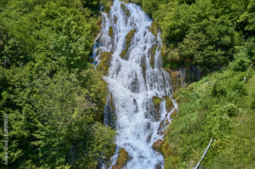 Aerial photography, waterfall in the mountains in the north of the Italian Alps. Cascate del Rio Bianco, near the city of Stenico, Trento. photo