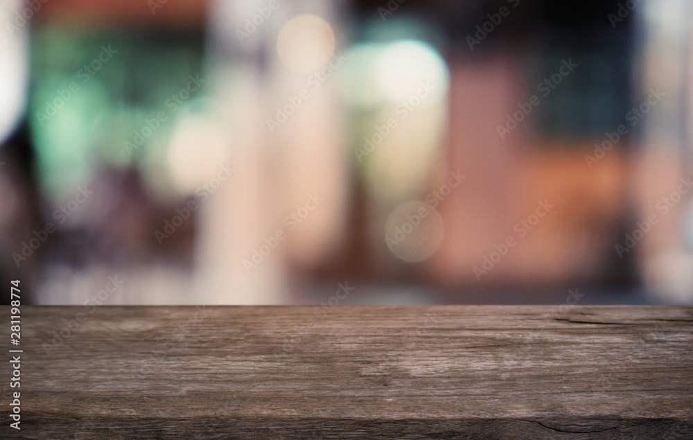Empty dark wooden table in front of abstract blurred bokeh background of restaurant . can be used for display or montage your products.Mock up for space. Empty dark wooden table in front of abstract blurred bokeh background of restaurant . can be used for display or montage your products.Mock up for space.
