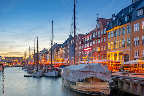 Nyhavn landmark buildings at night in Copenhagen city, Denmark
