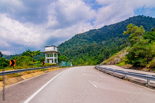 empty road in the middle of tropical forest at Fraser Hill, Malaysia