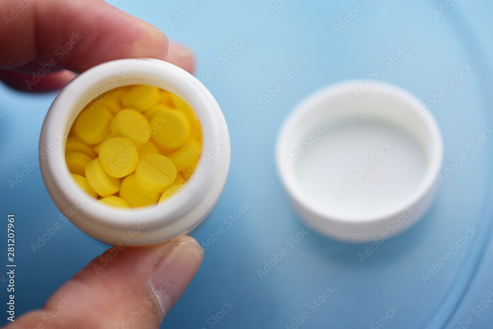 Yellow pills placed on the table Yellow pills placed on the table