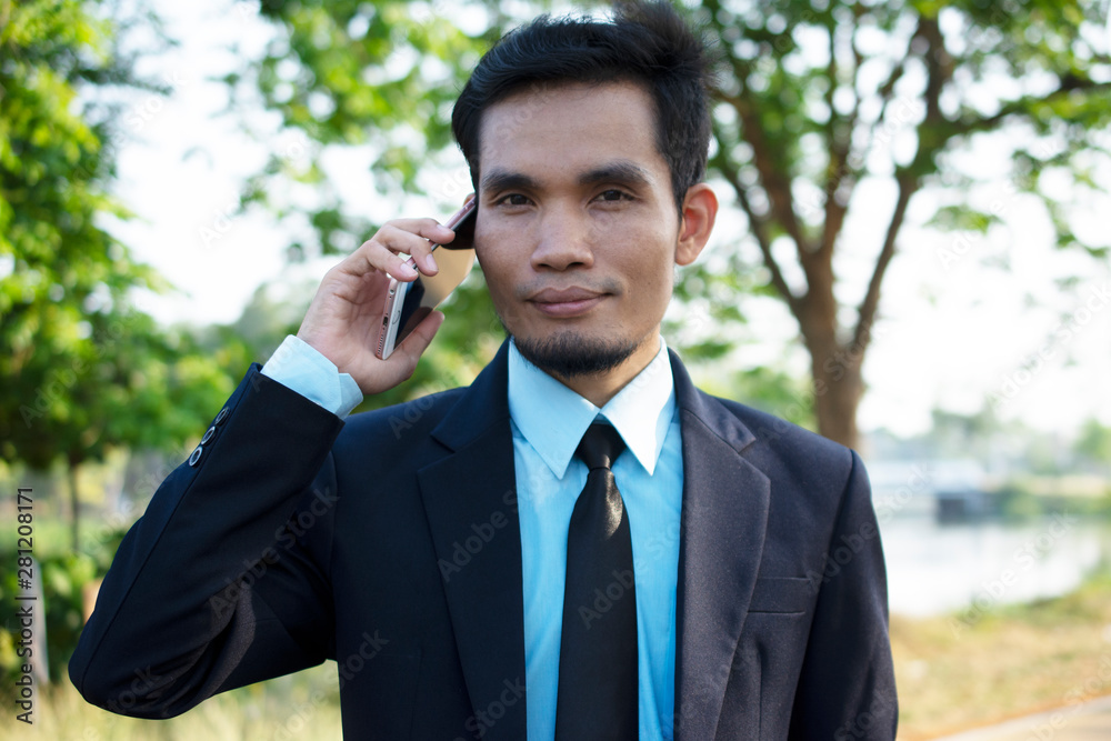 Businessman People holding Mobile Smart Phone and Talking phone Businessman People holding Mobile Smart Phone and Talking phone