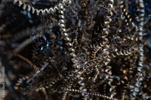 Close-up of twisted spiral steel shavings. Abstract background