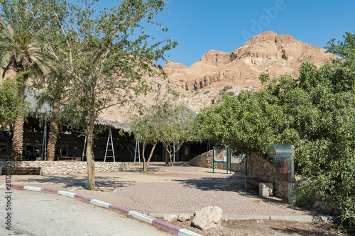 the entrance courtyard at ein gedi national park and reserve in israel with mount yishai and a clear blue sky in the background photo