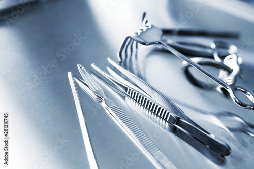 Stainless steel surgical instruments, forceps. Close up. Copy spase. Poster. placard, banner use. CMYK