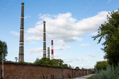 factory chimneys on background of blue sky