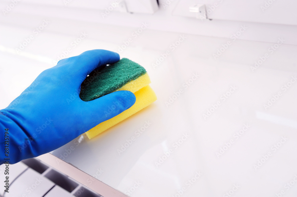 Worker's hand wipes dust and dirt indoors. A maid or housewife takes care of the house. Spring general or regular cleaning. The concept of a commercial cleaning company Worker's hand wipes dust and dirt indoors. A maid or housewife takes care of the house. Spring general or regular cleaning. The concept of a commercial cleaning company