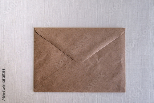Brown envelop on white background and vignette tone. Christmas background. Flat lay, top view, copy space. 