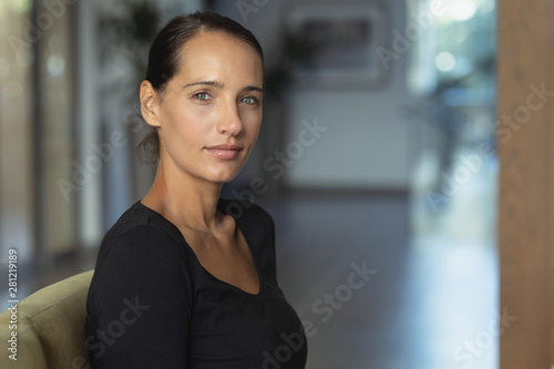 Woman sitting on sofa in the lobby at hospital