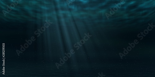 Sun and sunbeams underwater shining through ocean surface. Sea deep underwater