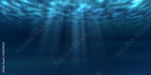 Sun and sunbeams underwater shining through ocean surface. Sea deep underwater