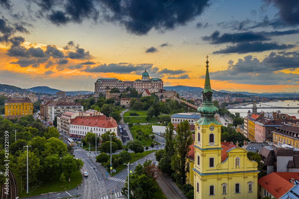 Budapest, Hungary - Aerial skyline view of Budapest with Saint Catherine of Alexandria Church, Buda Castle Royal Palace and Szechenyi Chain Bridge with a beautiful golden sunset at summer time